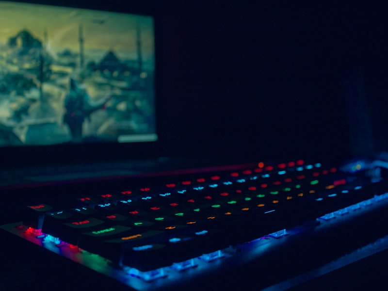 Mechanical keyboard glowing in teal light